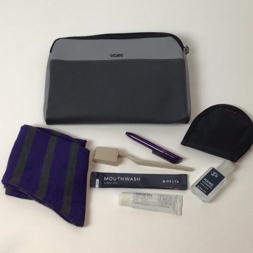 Almost complete Tumi amenities bag.